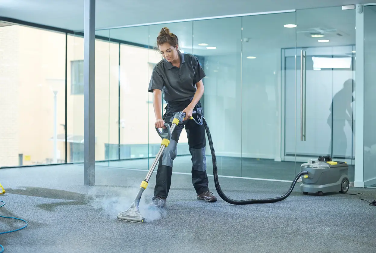 commercial carpet cleaner cleaning up a carpet